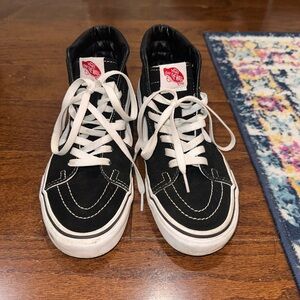 Vans Sk8-Hi sneakers. Women’s 8.5. Men’s 7. In black & white